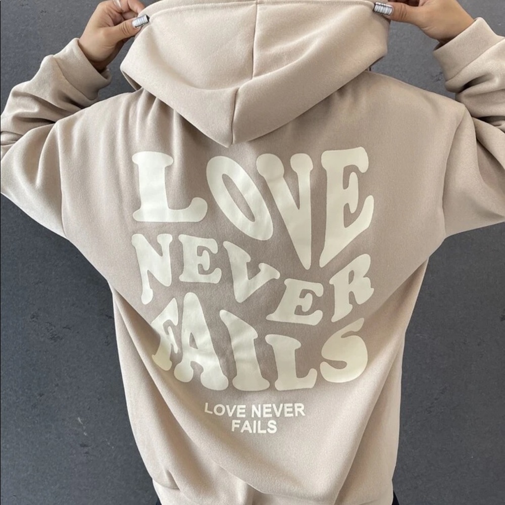 Love never fails hoodie